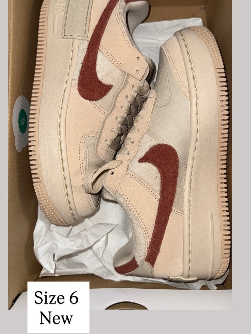 Nike Low-Top Sneakers in Cream with Rust Swoosh